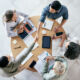 Shot of businessmen shaking hands during a team meeting in a modern office