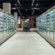 Empty supermarket aisle with refrigerators