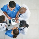 Shot of a diverse team of doctors viewing an x-ray on a digital tablet; Photo courtesy of Cecilie_Arcurs/E+/Getty Images