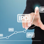 A businessperson pressing buttons that say 'IPO'