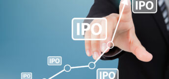 A businessperson pressing buttons that say 'IPO'