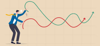 Businessman plays battle rope to control market graph