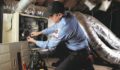 Technician servicing an HVAC system.